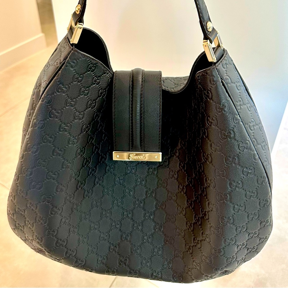 Authentic Guccissima Gucci  black bag with gold hardware. Bag is pristine.